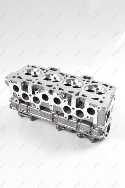 Головка блока цилиндров без шпилек в сборе (с направляющими втулками, без клапанов и вала распределительного) АвтоВАЗ